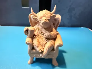 Highland Cow Chilling in Chair