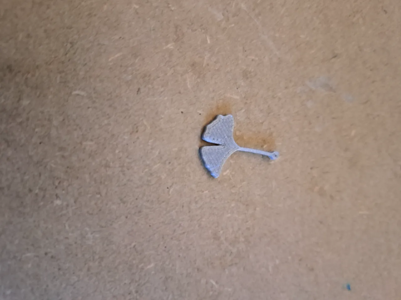 earring in the shape of a ginkgo leaf view 2