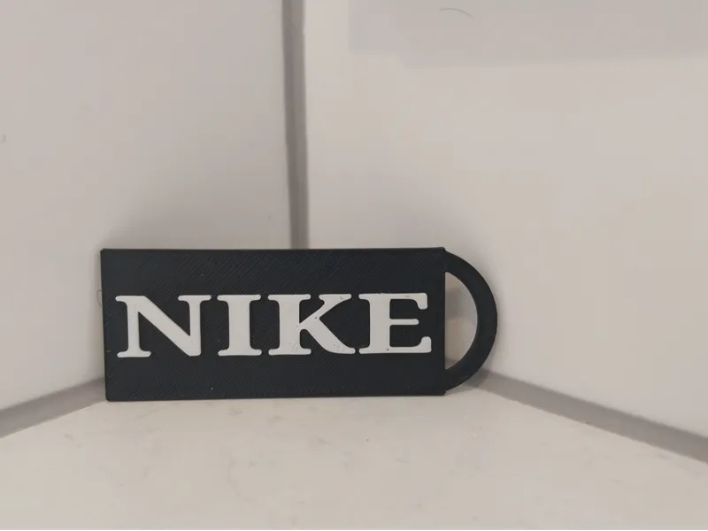 Nike keychain black and white.