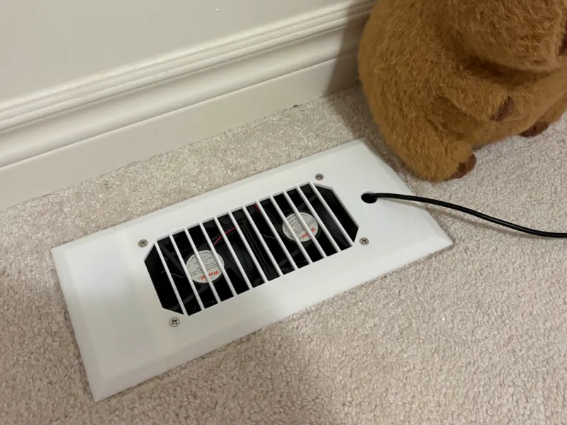 AC airflow booster fan bracket