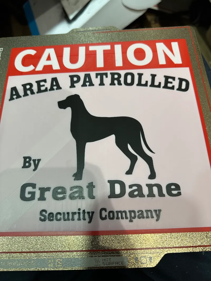 Area Patrolled by Great Dane Security Company Sign