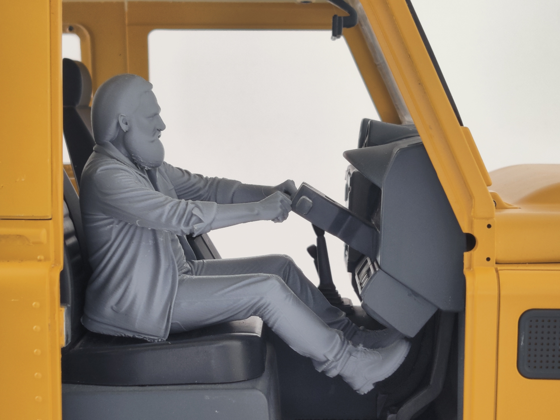 Driving figure older man with beard and lose coat