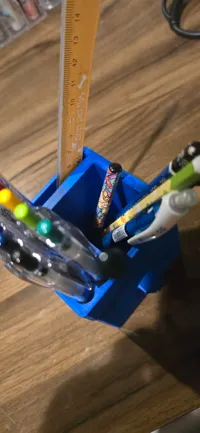 10 hole for pens, one big hole, and a thin hole for a ruler.