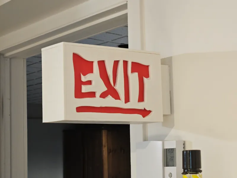 melting EXIT sign