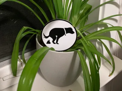 Dog Pooping Plant Stake