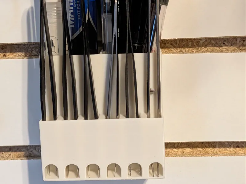 Slatwall holder for tweezers and pens
