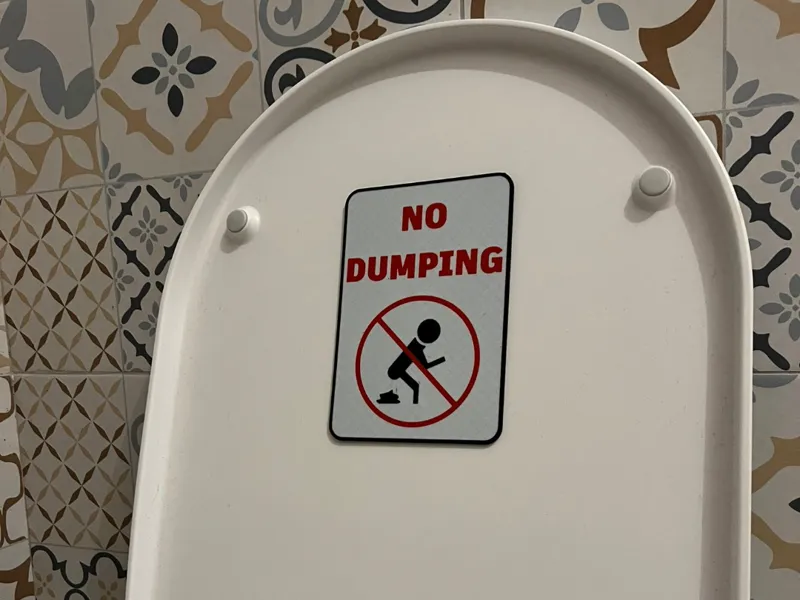 "No Dumping" Bathroom Toilet Sign