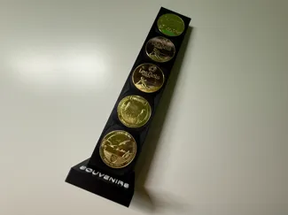 Présentoir à pièces souvenir