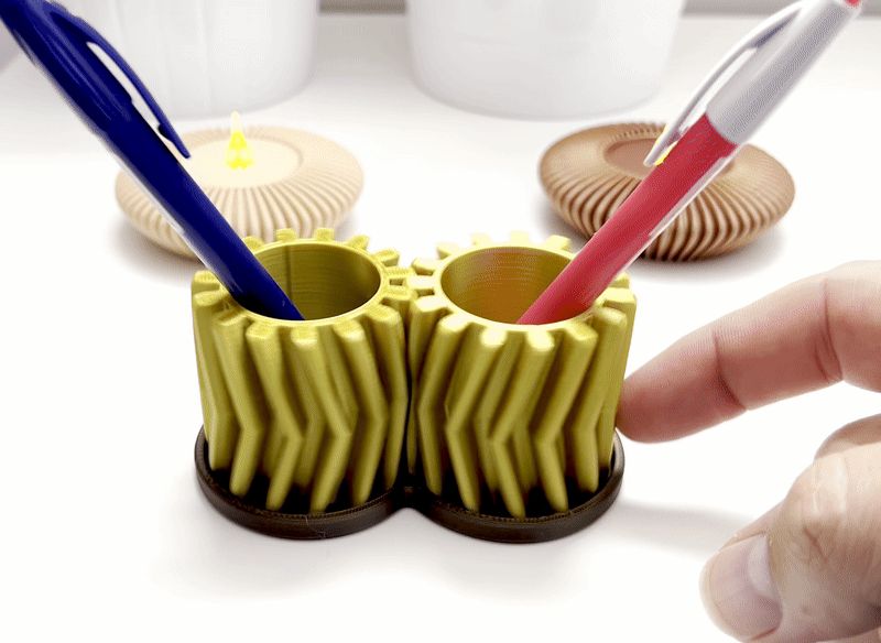 Movable helical pen holder