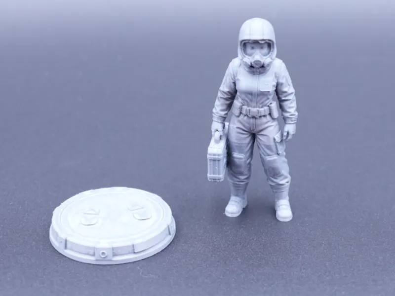 girl in a hazmat suit with stand.