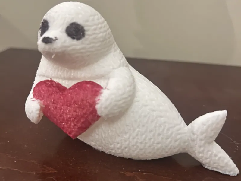 Cute Knitted Seal Holding Heart
