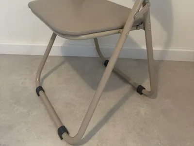 Foldable chair feet with felt pad holder