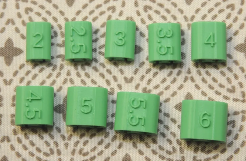 Marker for knitting needles