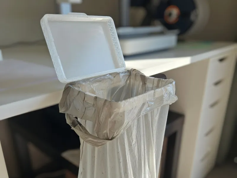 DeskBag: desk-mounted trash bag holder