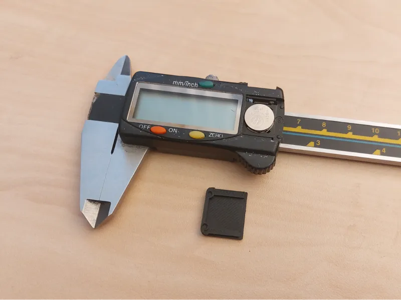 Caliper battery cover