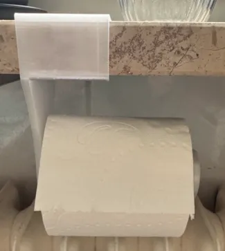 Toilet paper holder for windowsill.