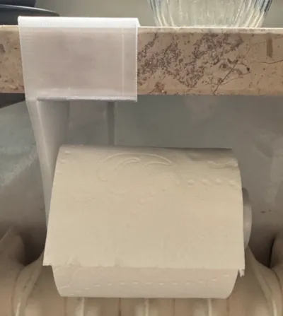 Toilet paper holder for windowsill.