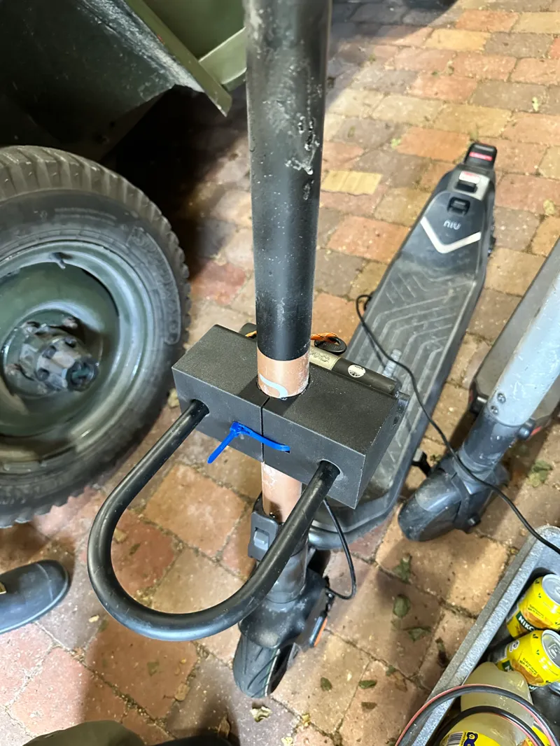 Lock attachment for kick bike - doubles as storage