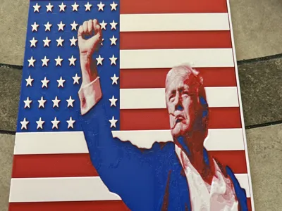 Trump fist pump with flag