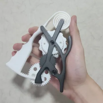 Objeto manipulable: Squeeze to Spin! (geared fidget toy) — vista de referencia 4
