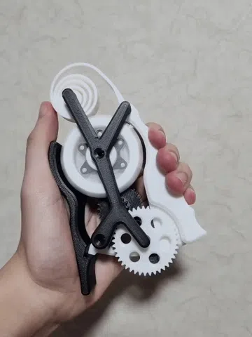 Objeto manipulable: Squeeze to Spin! (geared fidget toy) — vista de referencia 3