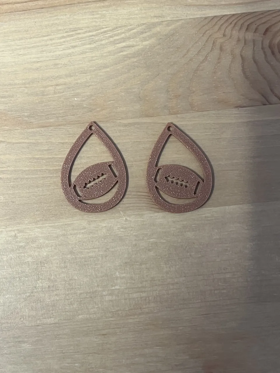 rugby ball earrings view 2
