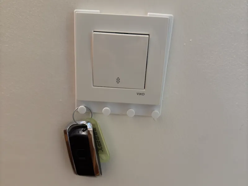 Light switch frame key hanger