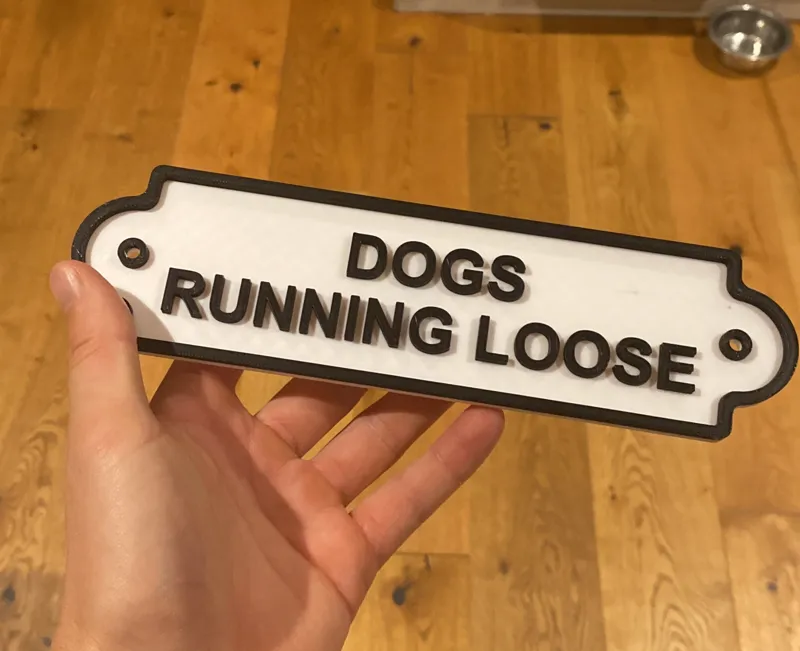 "Dogs running loose" sign