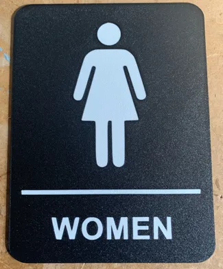 Women's Bathroom Sign Face Down