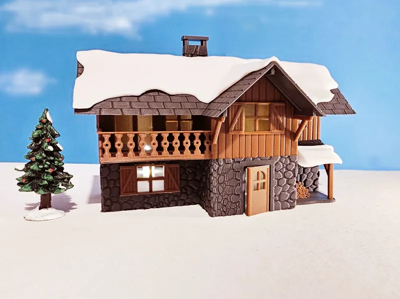 Snowy mountain chalet. House for christmas village
