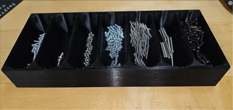 7-bowl storage bin for small screws and parts. 