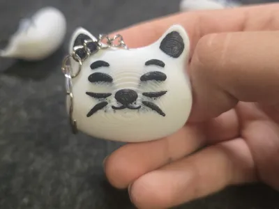 Chinese cat keychain angry/happy