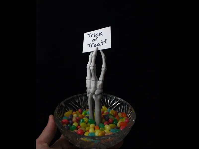 Skeleton hand Halloween candy note holder 