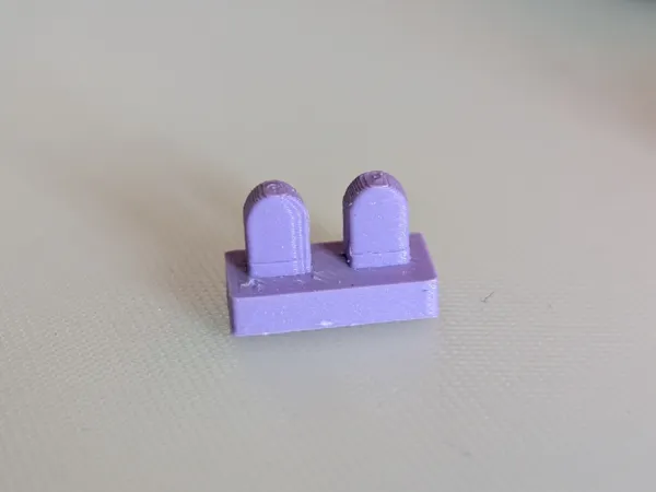 Socle protège-talons pour figurines à briques