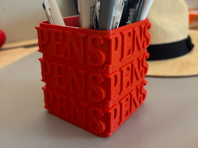 Pen holder with typographic design