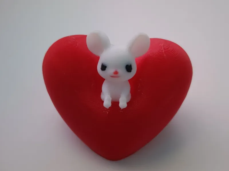Little mouse sitting on big heart, Valentines