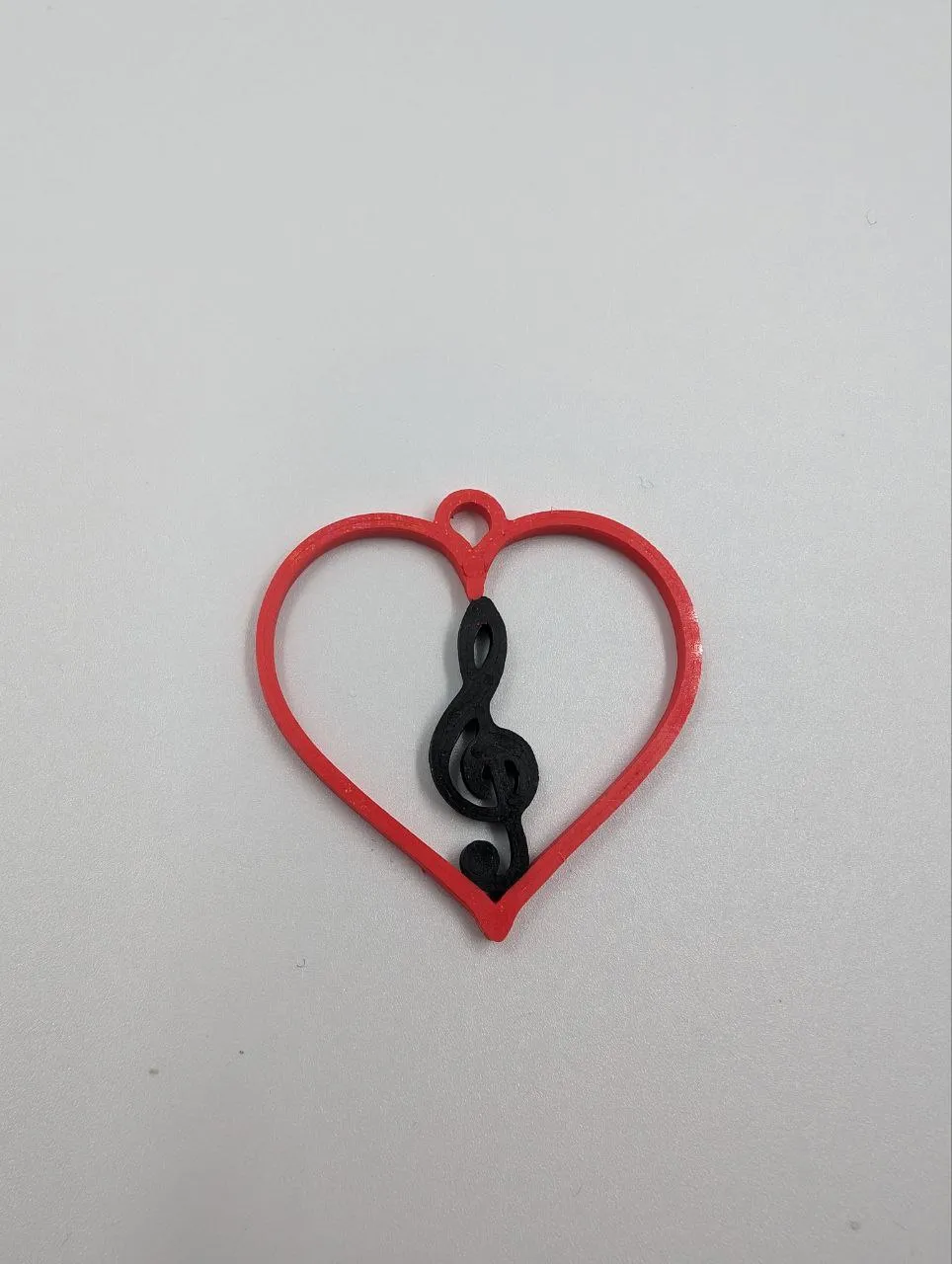 Treble clef heart earring view 2