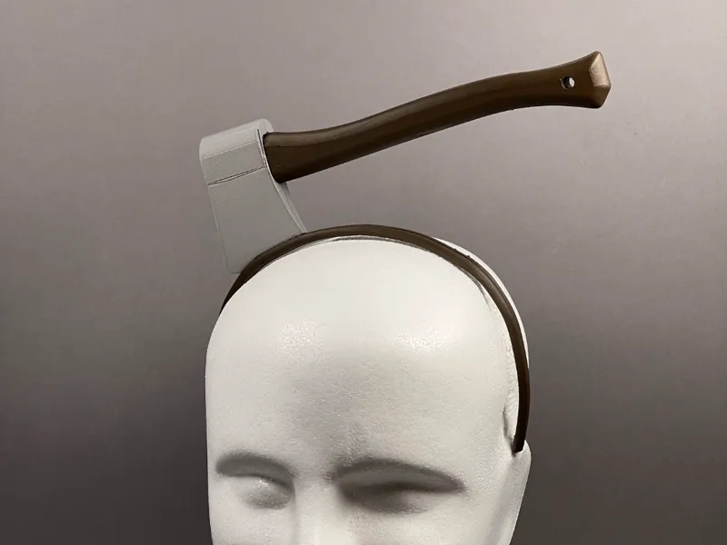 Axe through the head band (prop)
