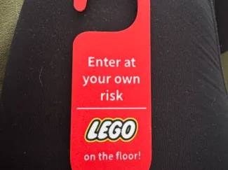 Leg0 on the floor warning door sign