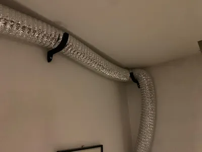 Wall mount for suction pipe