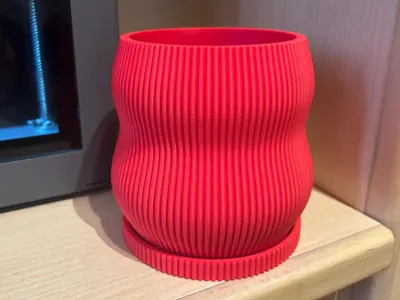 Pot and saucer with vertical stripes