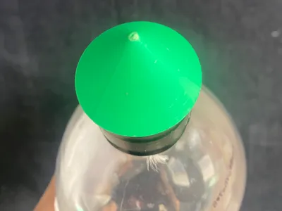 Bottle cap drip for plants