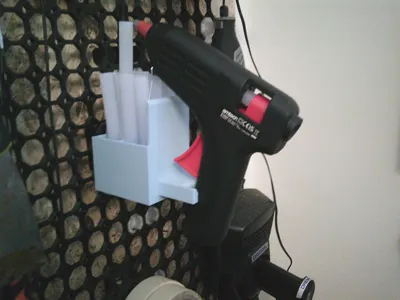 Glue gun holder for board with horizonal push-fit