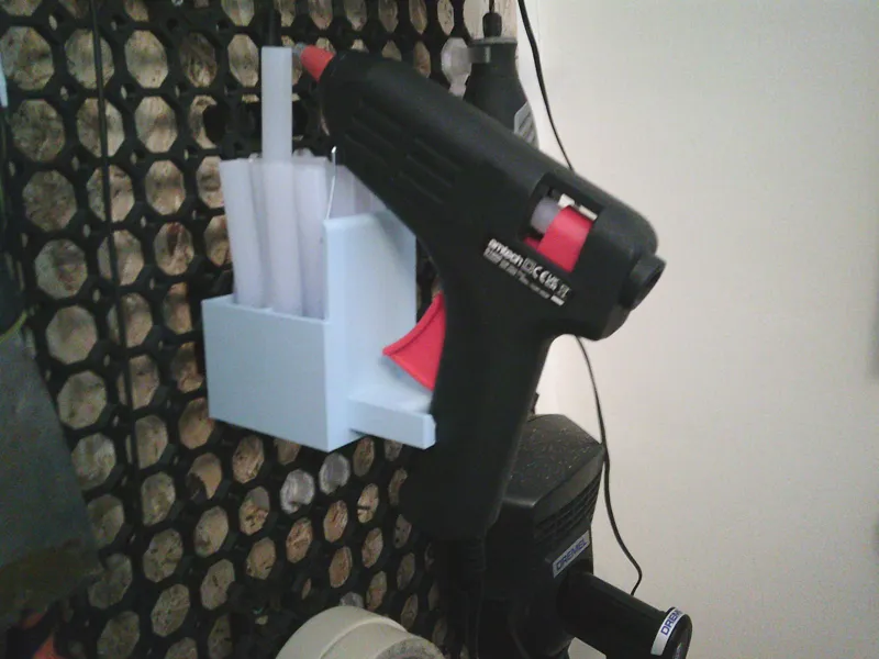 Glue gun holder for board with horizonal push-fit