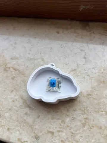 Objeto manipulable: Clicker Snoopy — vista de referencia 4