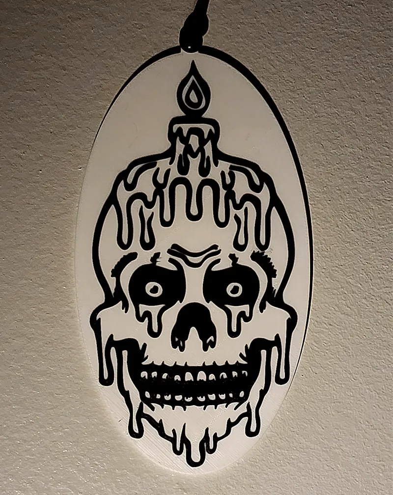 Melting Skull plaque with pinhole on top