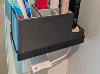Toothbrush holder with Oral-B charger base slot