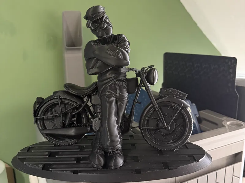 popeye leaning up against his bike