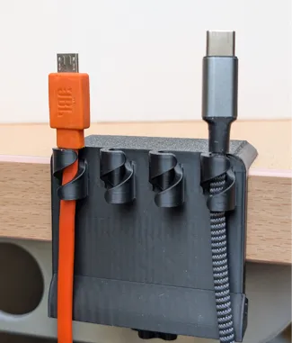 Fancy cable holder with adjustable mounting clamp