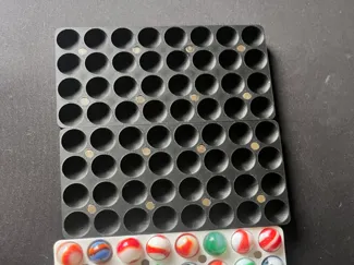 Magnetic marble storage box and display